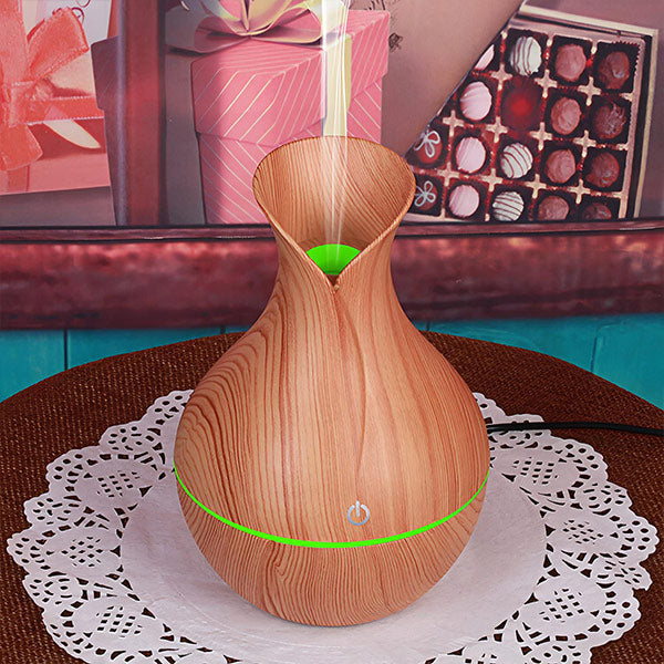 AromaMist – Compact LED Humidifier with Essential Oils