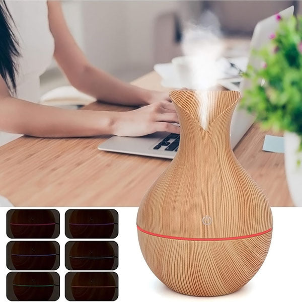 AromaMist – Compact LED Humidifier with Essential Oils